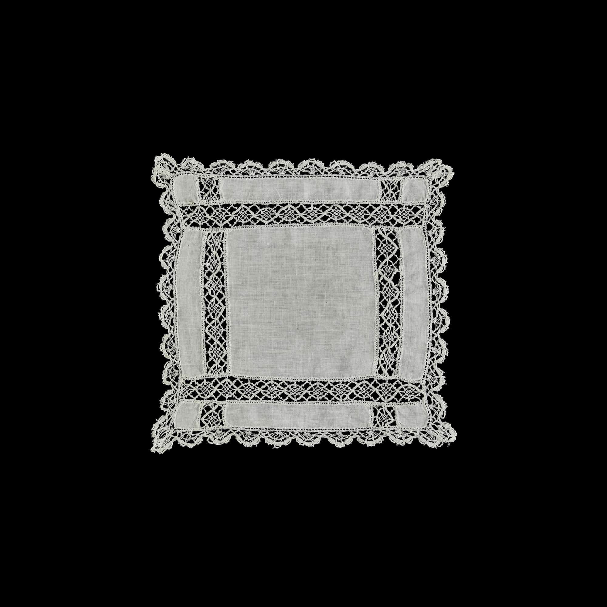 Square white linen doily handmade in Portugal, featuring intricate lace trim and openwork embroidery.