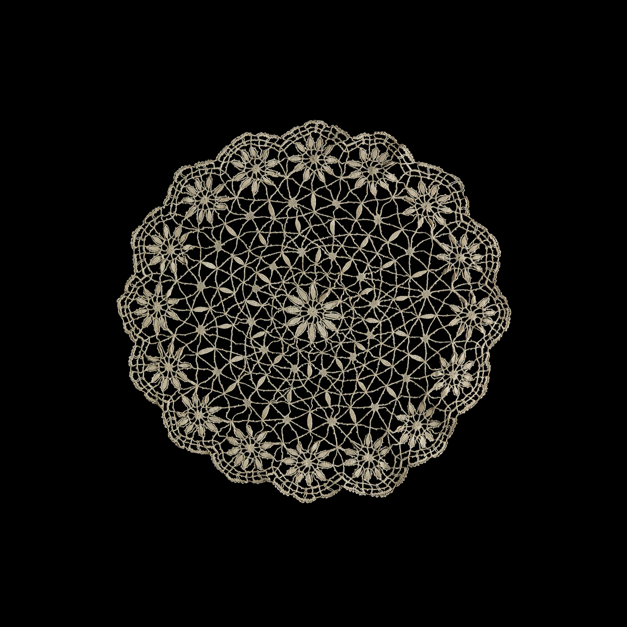 Handmade beige cotton doily featuring floral openwork and crochet motifs.